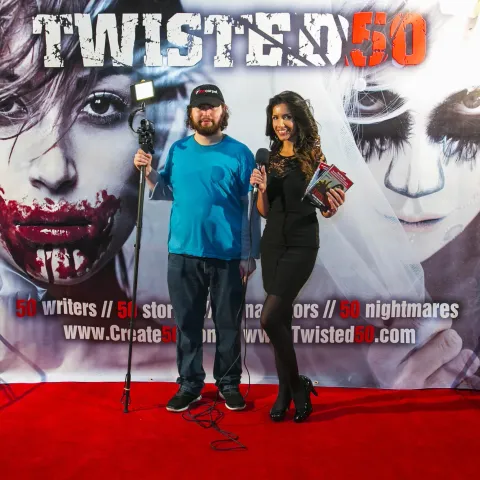 A man and woman posing for a photo at the twisted 50 premiere.